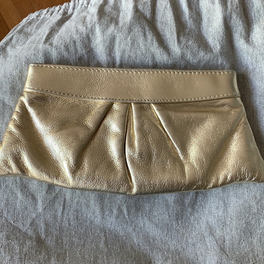 Lauren Merlín gold clutch